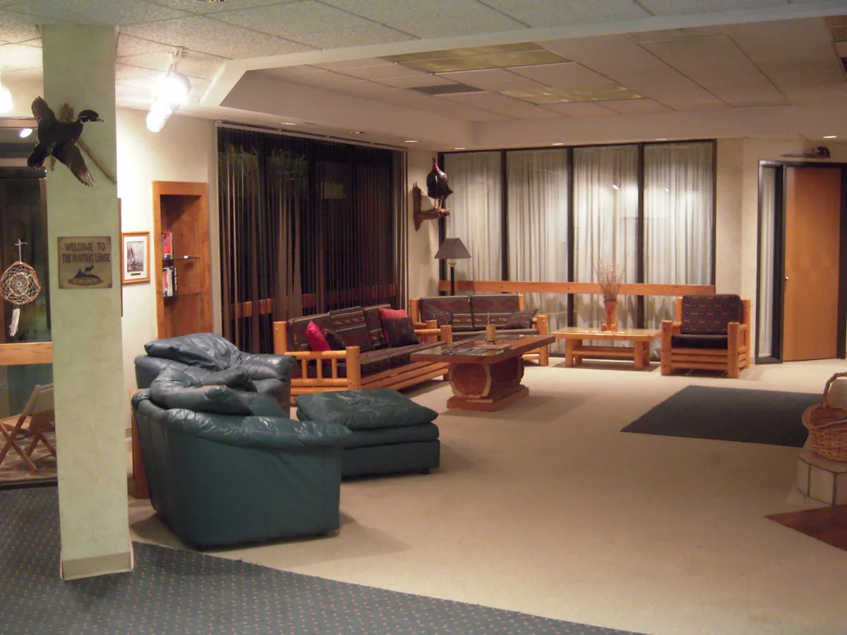 Archival gathering room with comfortable seating around a wooden table